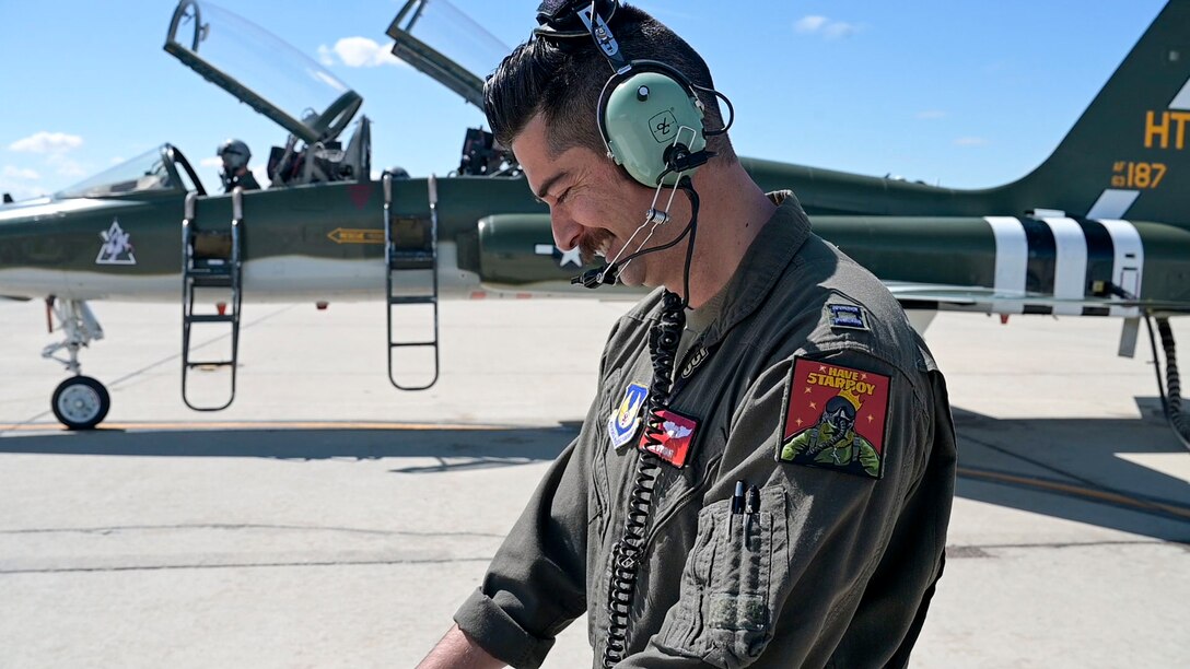 Capt. Steve "Nike" O'Briant, Project Pilot uses a test kit to test the "5tarboy" GPS system on the T-38C.