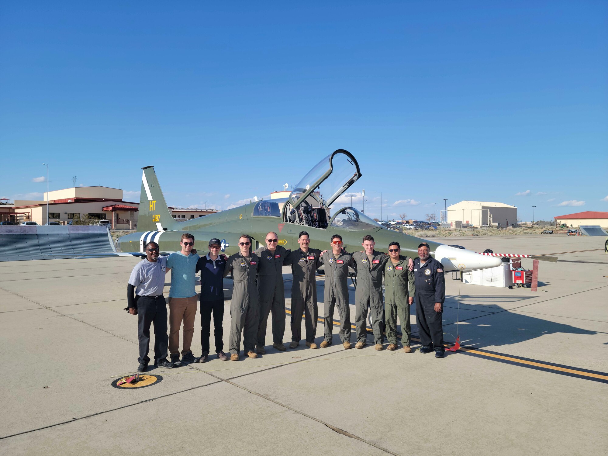 The "Have 5tarboy" team poses for a photo in front of a T-38C from Holloman. (Members: Steve "Nike" O'Briant, Project Pilot, Capt. Nathan "Loball" Raquet, Project Lead/Engineer, Joshua Morales, CEO of StarNav, Capt. Ajericho "Saint" Malia, Project Engineer, Squadron Leader Stephen "Tavo" Tavener Project Pilot (UK), Capt. Casey "Sandman" Slattery, Project Engineer, Maj. Matt "Doc" Daugherty, Project Pilot)