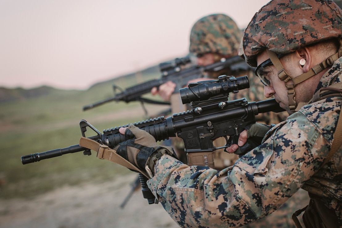 U.S. Marine Corps Maj. Peter Shelton, the air operations officer assigned to the 15th Marine Expeditionary Unit, engages targets with an M4 carbine as part of a combat marksmanship program table five range at Marine Corps Base Camp Pendleton, California, Feb. 1, 2023.