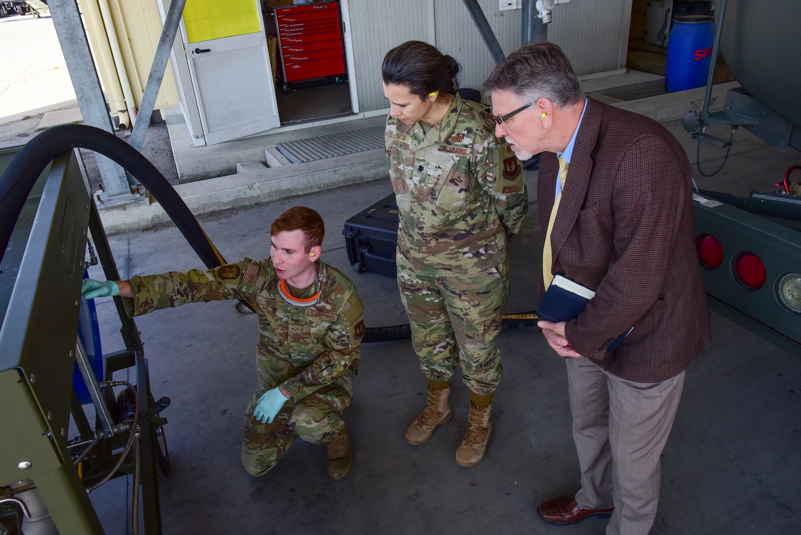 Senior Airman Anthony Bell, 31st Logistics Readiness squadron fuels service center controller demonstrates capabilities of the new Fluid Powered Additive Injector Carts concept to Mission Support Group leadership