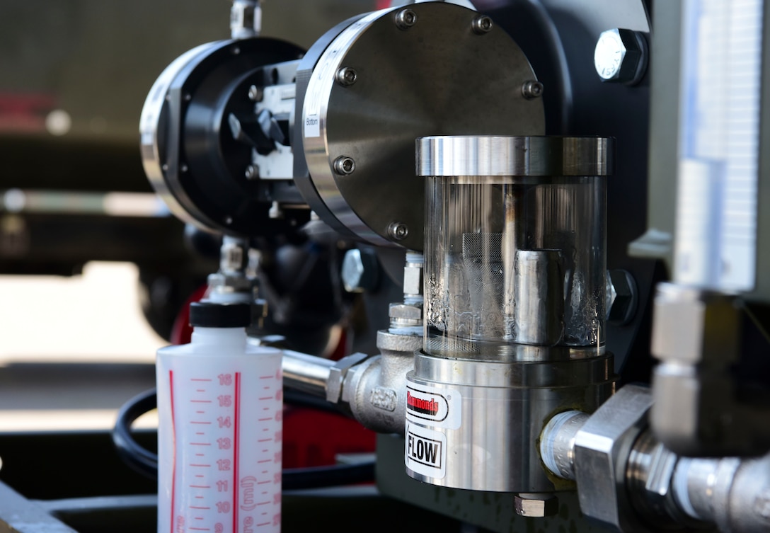 Senior Airman Anthony Bell, 31st Logistics Readiness squadron fuels service center controller demonstrates capabilities of the new Fluid Powered Additive Injector Carts concept to Mission Support Group leadership