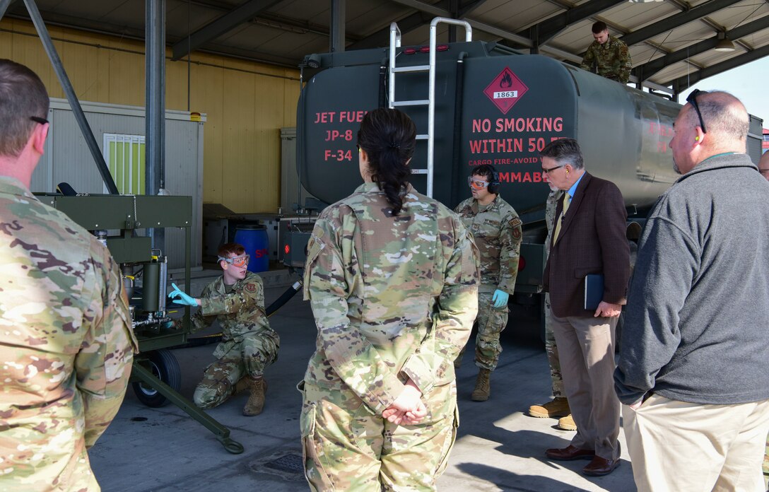 Senior Airman Anthony Bell, 31st Logistics Readiness squadron fuels service center controller demonstrates capabilities of the new Fluid Powered Additive Injector Carts concept to Mission Support Group leadership