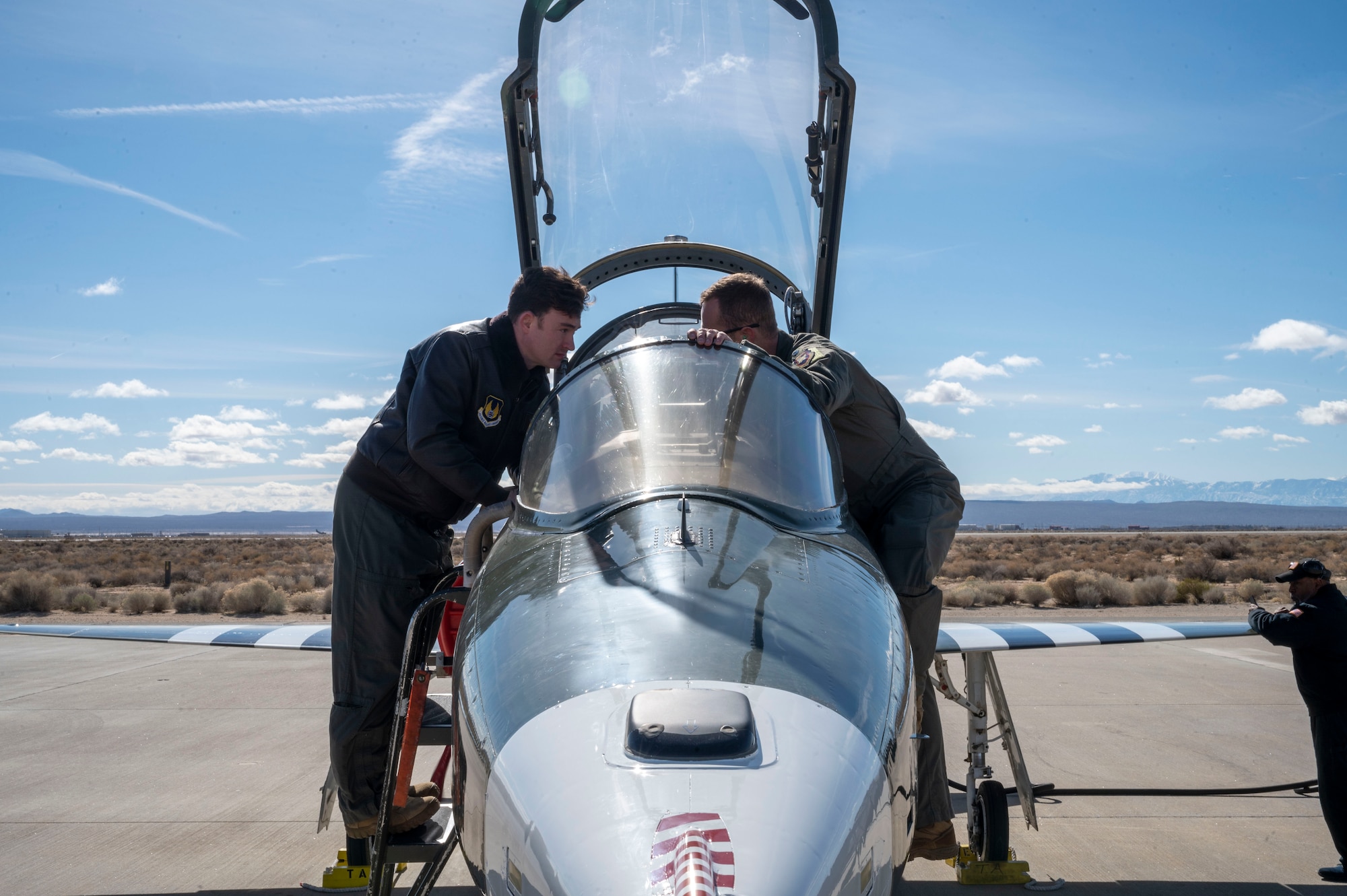 Maj. Matthew Daugherty, Project Pilot gets a lesson about the new GPS system "5tarboy". "5tarboy" would more utilize the GPS L5 signal reception through a TACAN antenna that would be more accurate for navigation guidance.