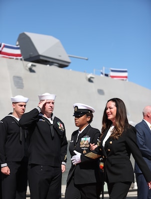 PORT HUENEME, Calif. (Apr 1, 2023) Command Senior Chief Rose Thibodeaux, Independence-class variant littoral combat ship USS Santa Barbara (LCS32), right, escorts the Ship's Sponsor, Lola Zinke during the LCS32 Commissioning Ceremony onboard Naval Base Ventura County (NBVC), Port Hueneme, Apr. 1, 2023. Littoral Combat Ships are fast, optimally-manned, mission-tailored surface combatants that operate in near-shore and open-ocean environments, winning against 21st-century coastal threats. LCS integrate with joint, combined, manned and unmanned teams to support forward presence, maritime security, sea control, and deterrence missions around the globe. NBVC is a strategically located Naval installation composed of three operating facilities: Point Mugu, Port Hueneme and San Nicolas Island. NBVC is the home of the Pacific Seabees, West Coast E-2D Hawkeyes, 3 warfare centers and 80 tenants. (U.S. Navy photo by Mass Communication 1st Class Douglas "Evan" Parker/Released)