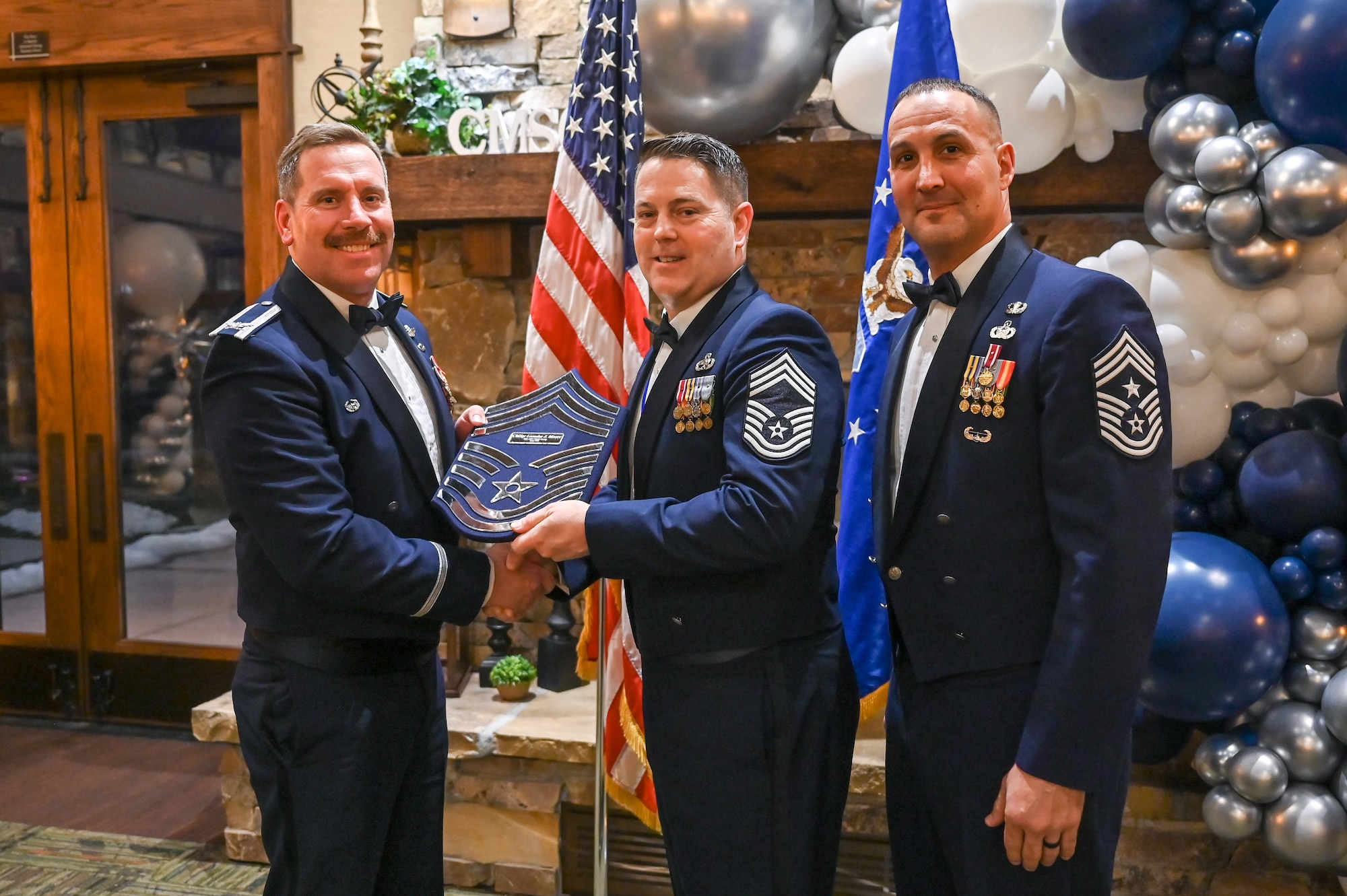 Chief Master Sgt. Leondas Moore (center), 388th Maintenance Squadron, poses with Col. Craig Andrle (left), 388th Fighter Wing commander, and Chief Master Sgt. Brandon Wolfgang