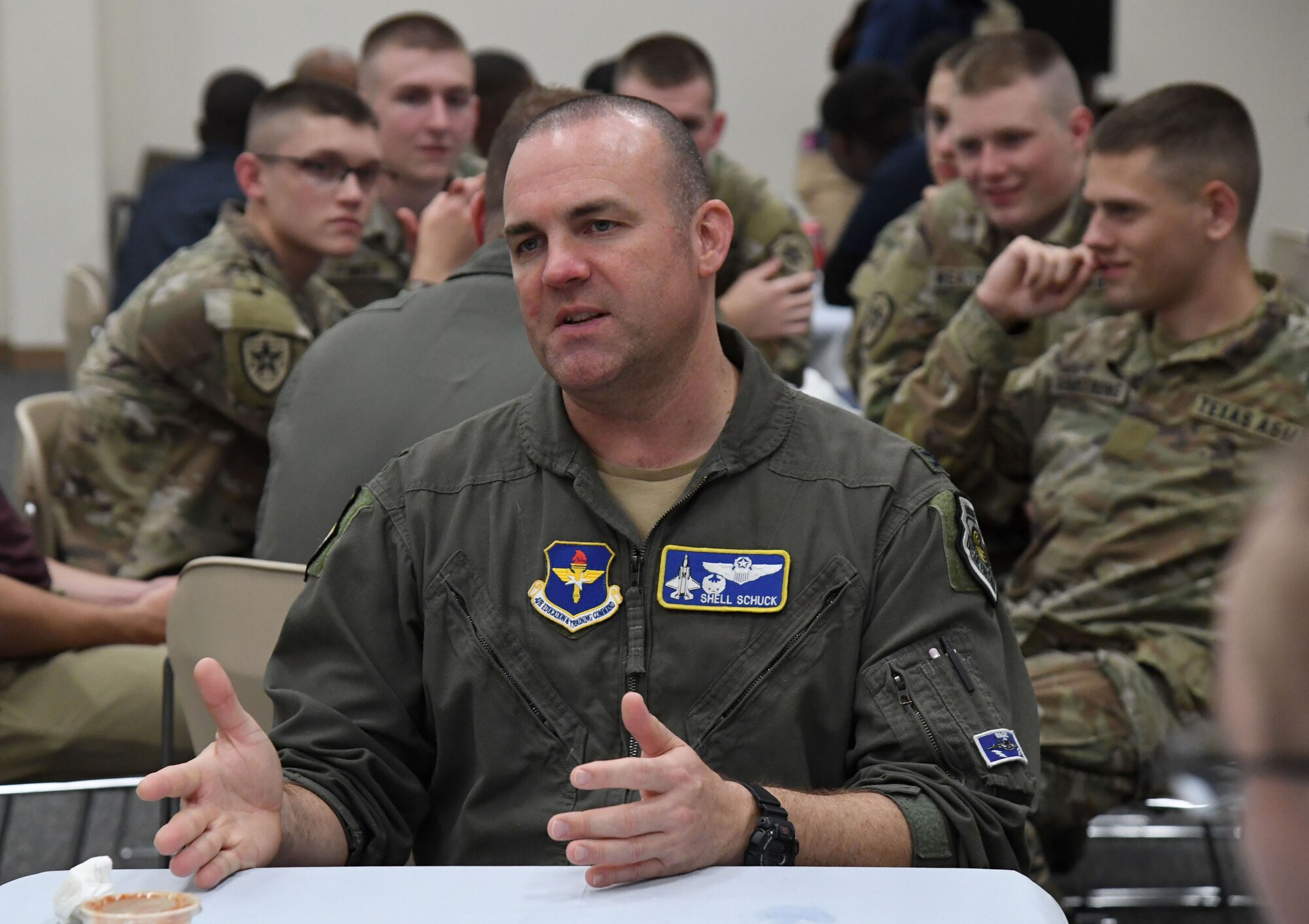 U.S. Air Force Col. Charles "Shell" Schuck, 33rd Operations Group commander, Eglin Air Force Base, Florida, participates in a speed mentoring session with Air Force ROTC cadets during Pathways to Blue inside the Roberts Consolidated Aircraft Maintenance Facility at Keesler Air Force Base, Mississippi, March 31, 2023.
