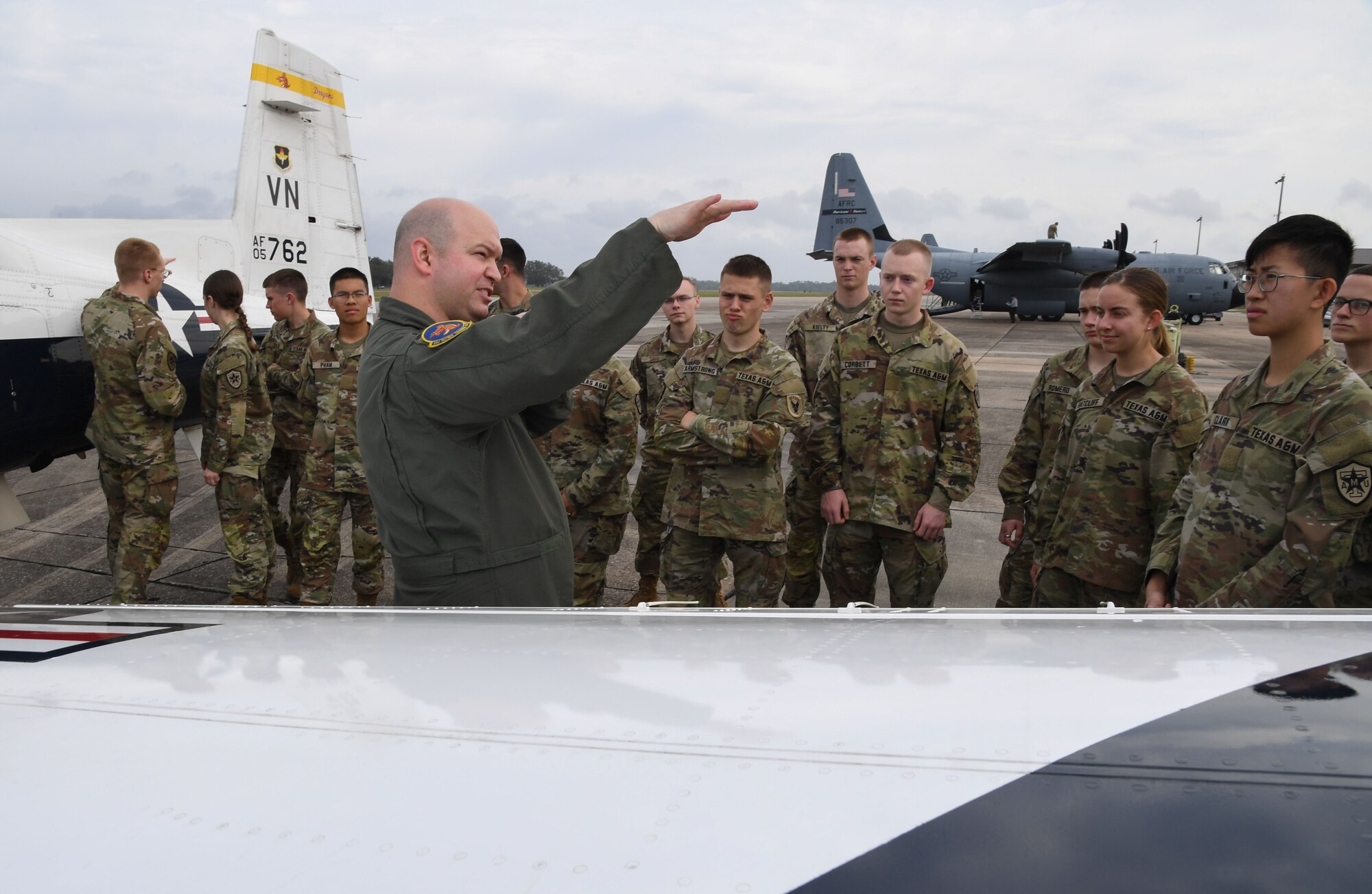 U.S. Air Force Capt. Jon Castor, 33rd Flying Training Squadron T-6 Texan instructor pilot, Vance Air Force Base, Oklahoma, briefs Air Force ROTC cadets on a T-6 Texan static display during Pathways to Blue at Keesler Air Force Base, Mississippi, March 31, 2023.