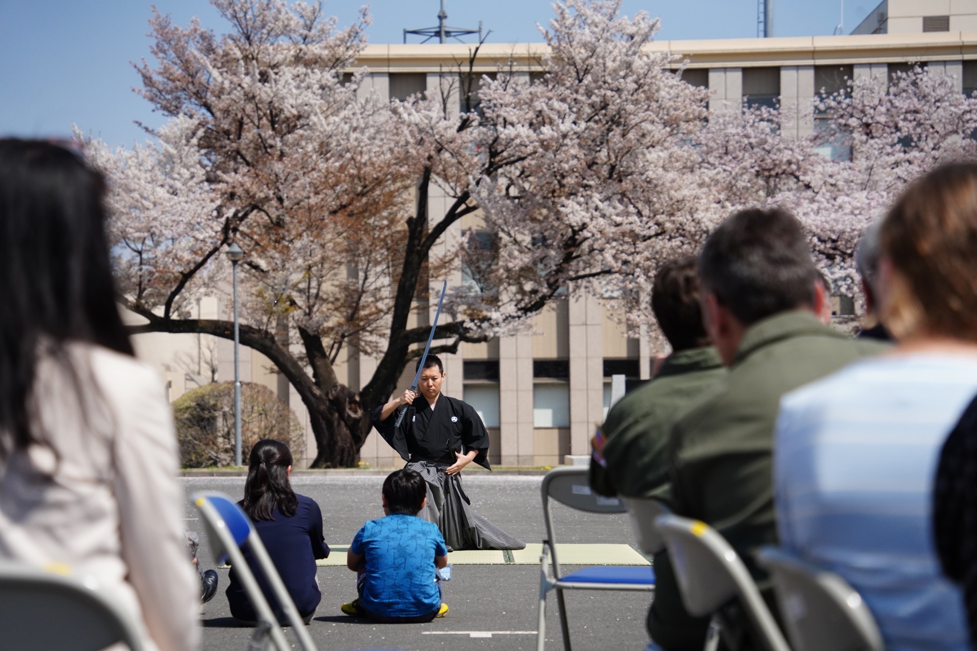 Japan Air Self-Defense Force Master Sgt. Takeshi Ishii, Operations Support Wing communication specialist, demonstrates his iaido swordsmanship skills to attendees of the JASDF OSW annual bilateral sakura viewing on April 1, 2023, at Yokota Air Base, Japan.