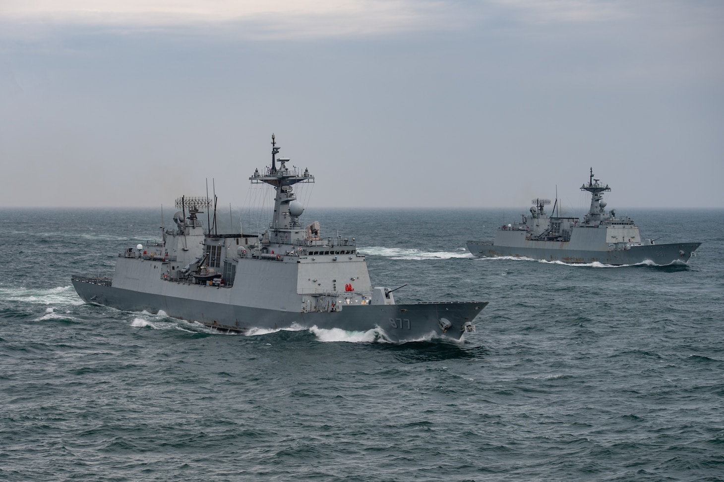 230404-N-DU622-1596 EAST CHINA SEA (April 4, 2023) The Republic of Korea (ROK) Navy Chungmugong Yi Sun-Shin-class destroyers ROKS Dae Jo young (DDH 977) and ROKS Choi Young (DDH 981) steam in formation with the aircraft carrier USS Nimitz (CVN 68). The Nimitz Carrier Strike Group is conducting a trilateral maritime exercise with the ROK Navy and Japan Maritime Self-Defense Force in the U.S. 7th Fleet area of operations. 7th Fleet is the U.S. Navy's largest forward-deployed numbered fleet, and routinely interacts and operates with allies and partners in preserving a free and open Indo-Pacific region. (U.S. Navy photo by Mass Communication Specialist 2nd Class Justin McTaggart)