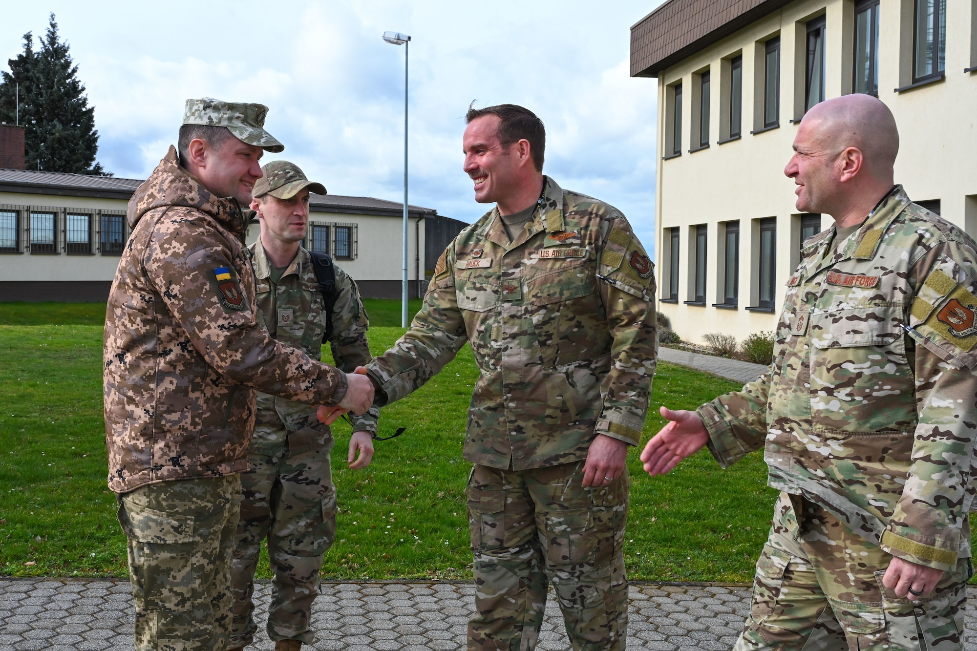U.S. Air Force Col. Leslie Hauck, 52nd Fighter Wing Commander, right, greets Chief Master Sgt. of the Air Force of the Armed Forces of Ukraine Kostiantyn Stanislavchuk