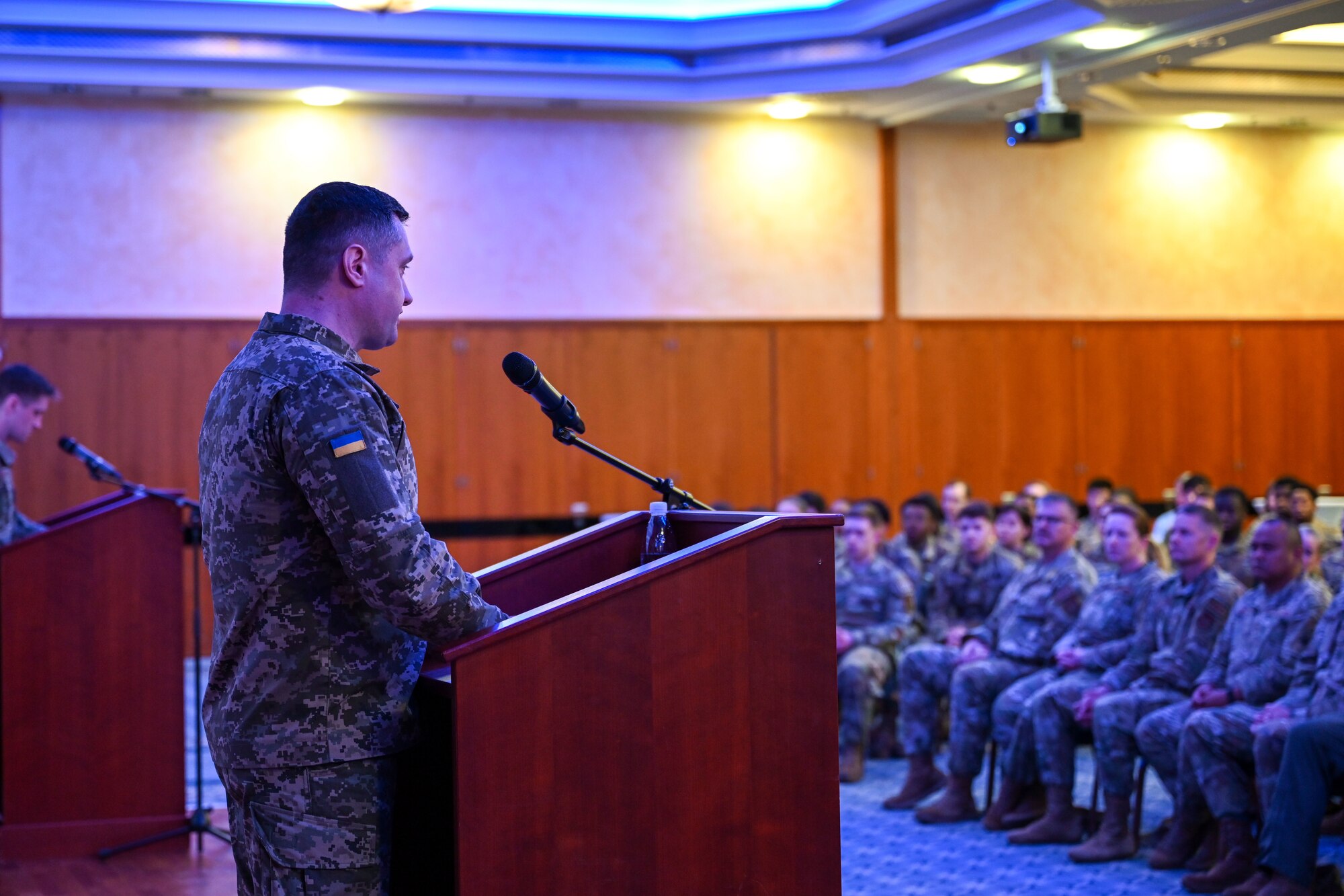 Chief Master Sgt. of the Air Force of the Armed Forces of Ukraine Kostiantyn Stanislavchuk speaks to attendees of an all-call