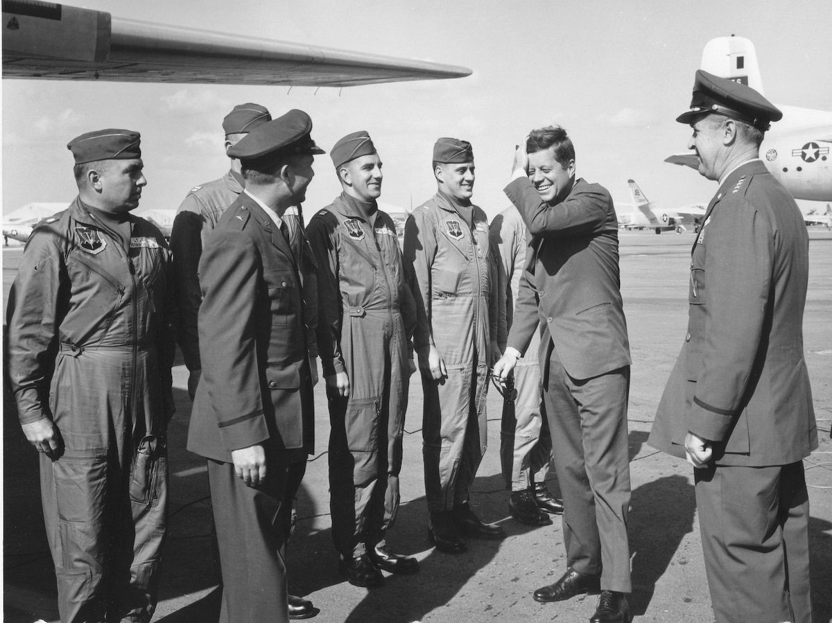 President John F. Kennedy visits with members of the 512th Troop Carrier Wing deployed to Homestead Air Force Base, Florida, after the Cuban Missile Crisis in 1962.