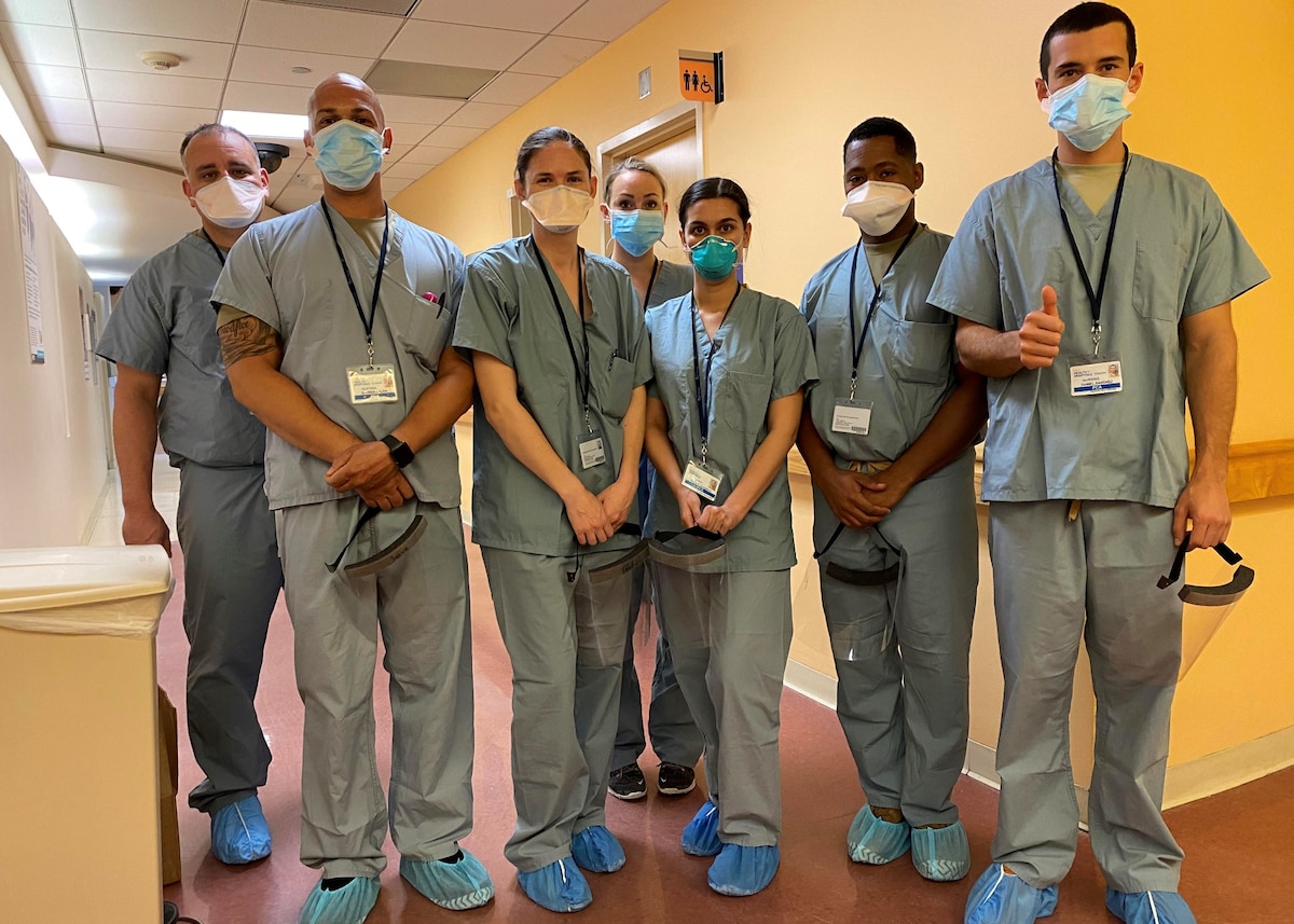 Reserve Citizen Airmen take a break during a shift at Queens Hospital Center in New York in May 2020. Doctors, nurses and medical technicians from throughout Air Force Reserve Command deployed to the city to help with patient overloads resulting from the Covid-19 pandemic.