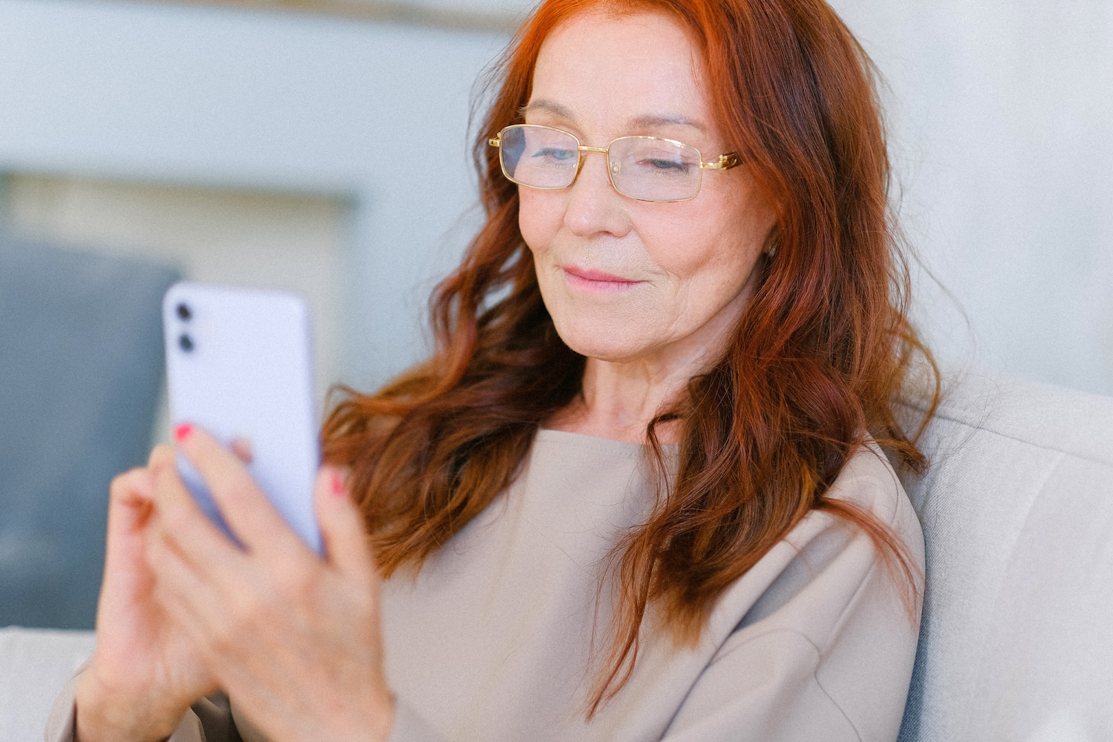 A woman checks her mobile phone