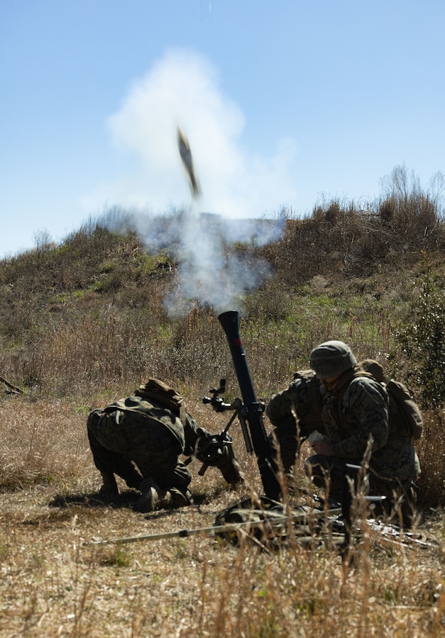 U.S. Marines with 1st battalion, 8th Marine regiment, 2d Marine Division fire an M252 81mm mortar system during a support naval gunfire exercise on Camp Lejeune, North Carolina, March 15, 2023. The purpose of this exercise was to to gain proficiency in integrating and de-conflicting fixed wing, rotary wing, and indirect fires in the prosecution of targets while solidifying communication architecture. (U.S. Marine Corps photo by Lance Cpl. Joshua Kumakaw)