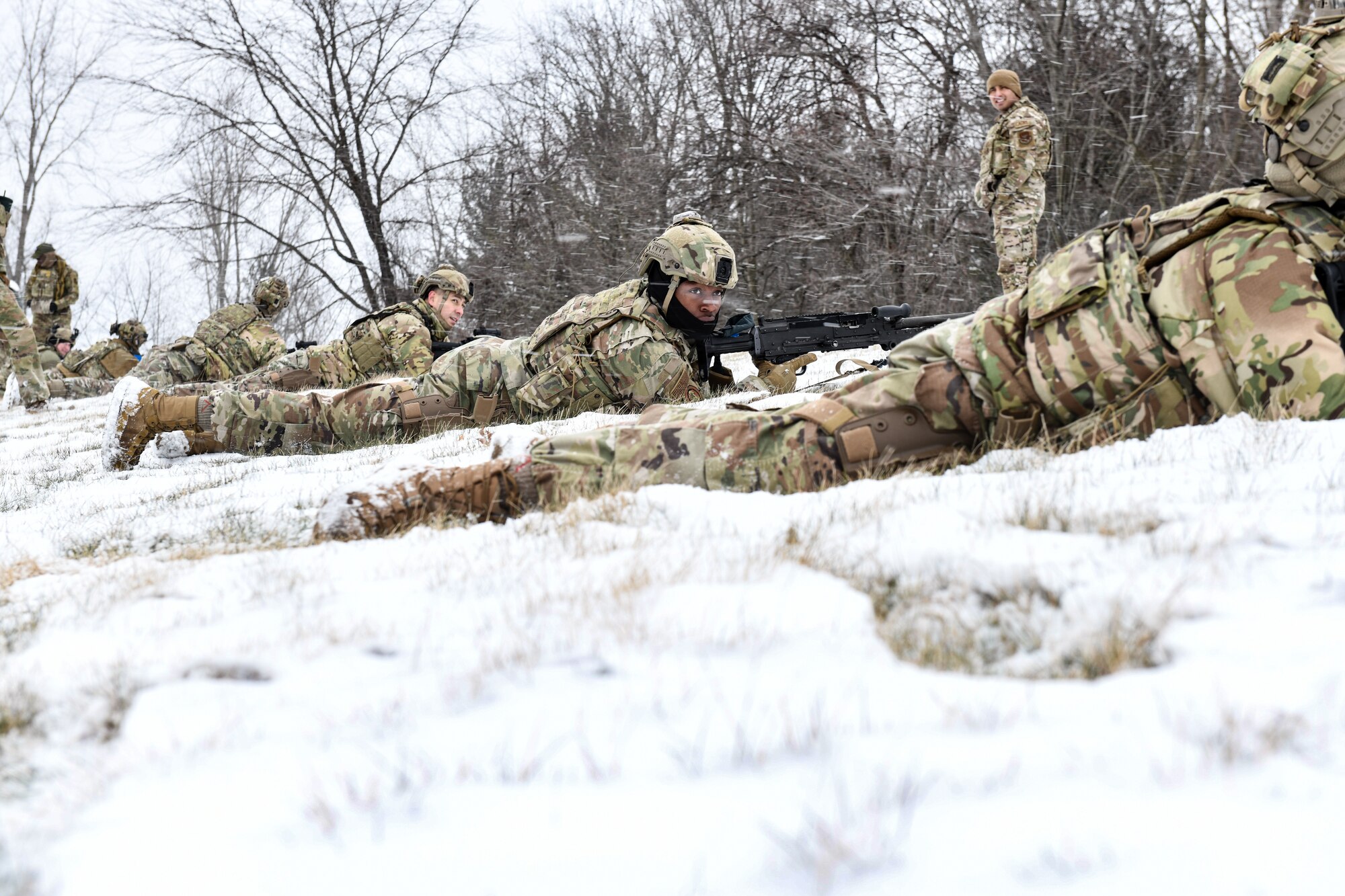 Airmen assigned to the 459th Security Forces Squadron, Joint Base Andrews, Maryland, practice tactical fire maneuvers on March 14, 2023, at Youngstown Air Reserve Station, Ohio.