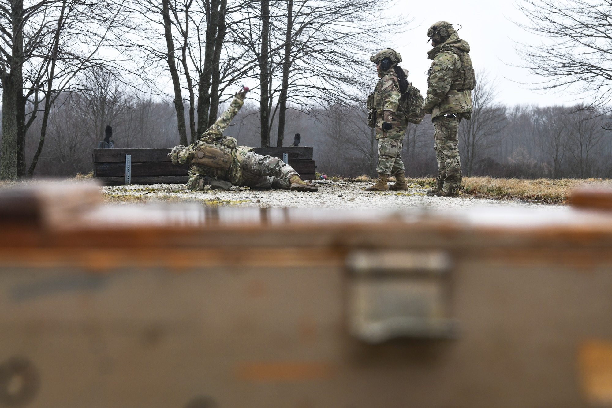 Integrated Defense Leadership Course cadre demonstrate how to throw a grenade on March 17, 2023, at Camp James A. Garfield Joint Military Training Center, Ohio.