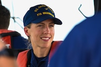 U.S. Coast Guard Lt. Cmdr. Cathleen Giguere, commanding officer at Coast Guard Station Washington, tells 11th Wing Airmen her story of becoming an officer in the Coast Guard at Joint Base Anacostia-Bolling, Washington, D.C., Aug. 30, 2022. In 2015, The Navy League of the United States awarded Giguere the David H. Jarvis Award for Inspirational Leadership for her dedication, judgment, and devotion to duty. (U.S. Air Force photo by Airman Bill Guilliam