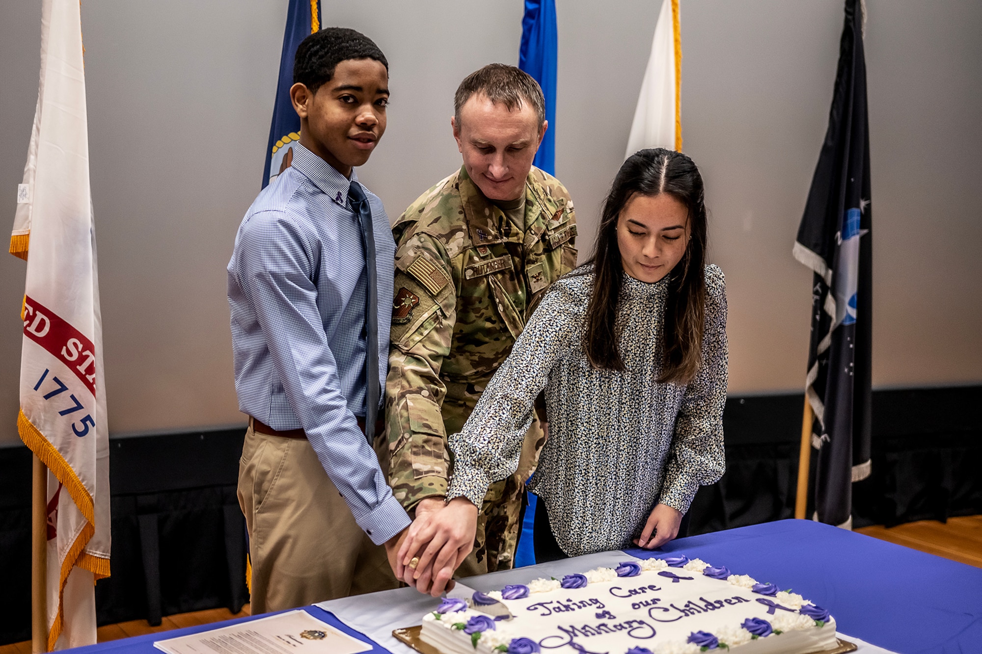 A photograph depicting a ceremony for the Month of the Military Child.