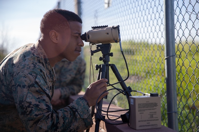 U.S. Marine Corps Cpl. Trent Holton, a transmissions system operator with 9th Communication Battalion, I Marine Expeditionary Force Information Group, sights into the common laser range finder-integrated capability system as part of a call-for-fire practical application class during the ANGLICO Basic Course at Marine Corps Base Camp Pendleton, California, March 8, 2023. ABC graduates will depart as technically and tactically proficient Marines capable of making sound decisions in complex operational situations and with a baseline understanding of ANGLICO mission-specific skill sets, regardless of military occupational specialty.