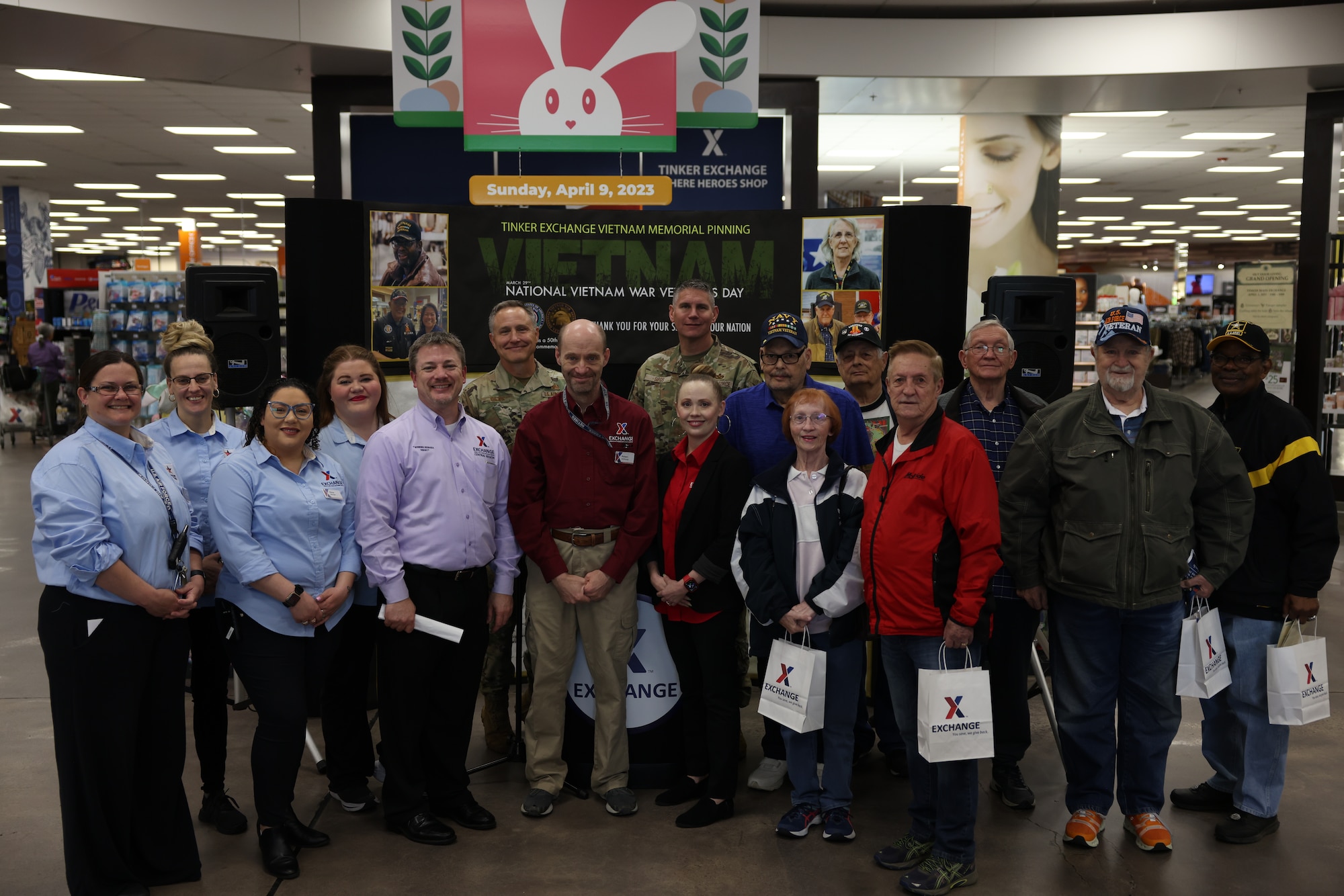 Group photo of Exchange staff, 72nd ABW leadership and Vietnam Veterans.