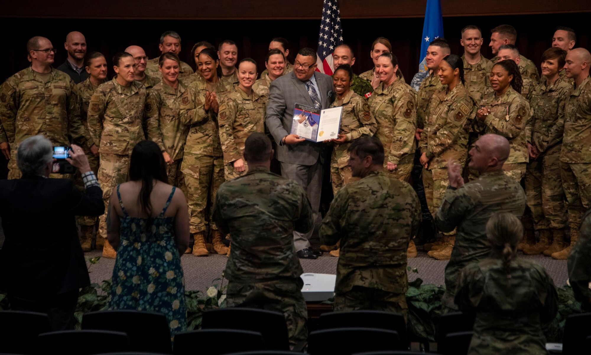 Air Force Sergeants Association Executive Director Keith Reed presents the instructors and staff of the Air Force Senior Noncommissioned Officer Academy with the AFSA Americanism Award, March 31, 2023, for their efforts to develop programs, ceremonies and other initiative that further patriotism in the United States of America. The presentation occurred during the SNCOA assumption of leadership ceremony at the academy on Maxwell Air Force Base–Gunter Annex, Ala. (U.S. Air Force photo/Brian Ferguson)