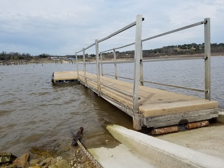 A boat ramp sits in the water at Tuttle Creek Cove campground.