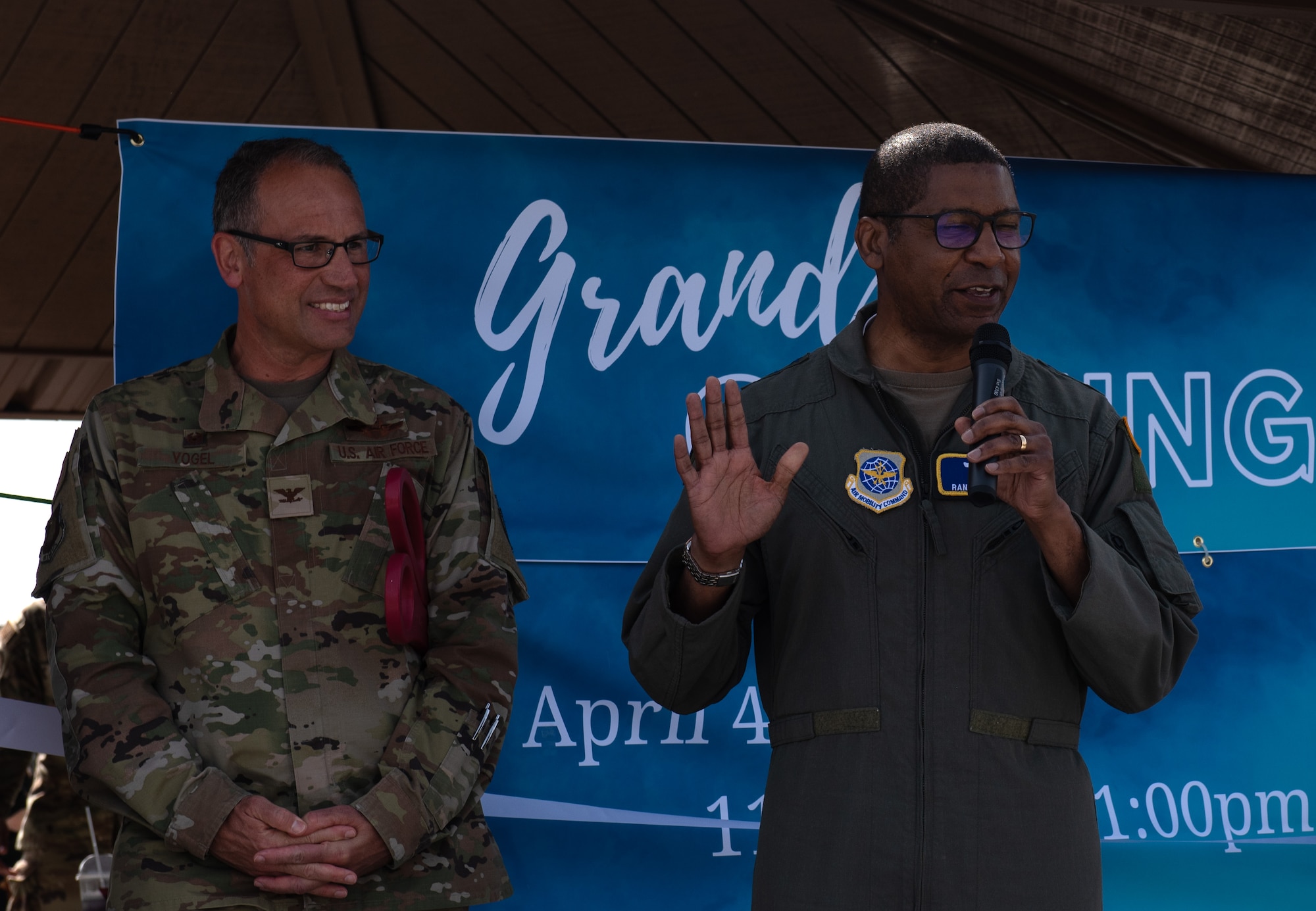 Lt. Gen. Randall Reed, Air Mobility Command deputy commander, gives opening remarks at the grand opening for the food truck park at McConnell Air Force Base, Kansas, April 4, 2023. The food truck park provides a variety of easily accessible food for Team McConnell servicemembers. The area was designated a no hat, no salute area for the grand opening. (U.S. Air Force photo by Staff Sgt. Tryphena Mayhugh)