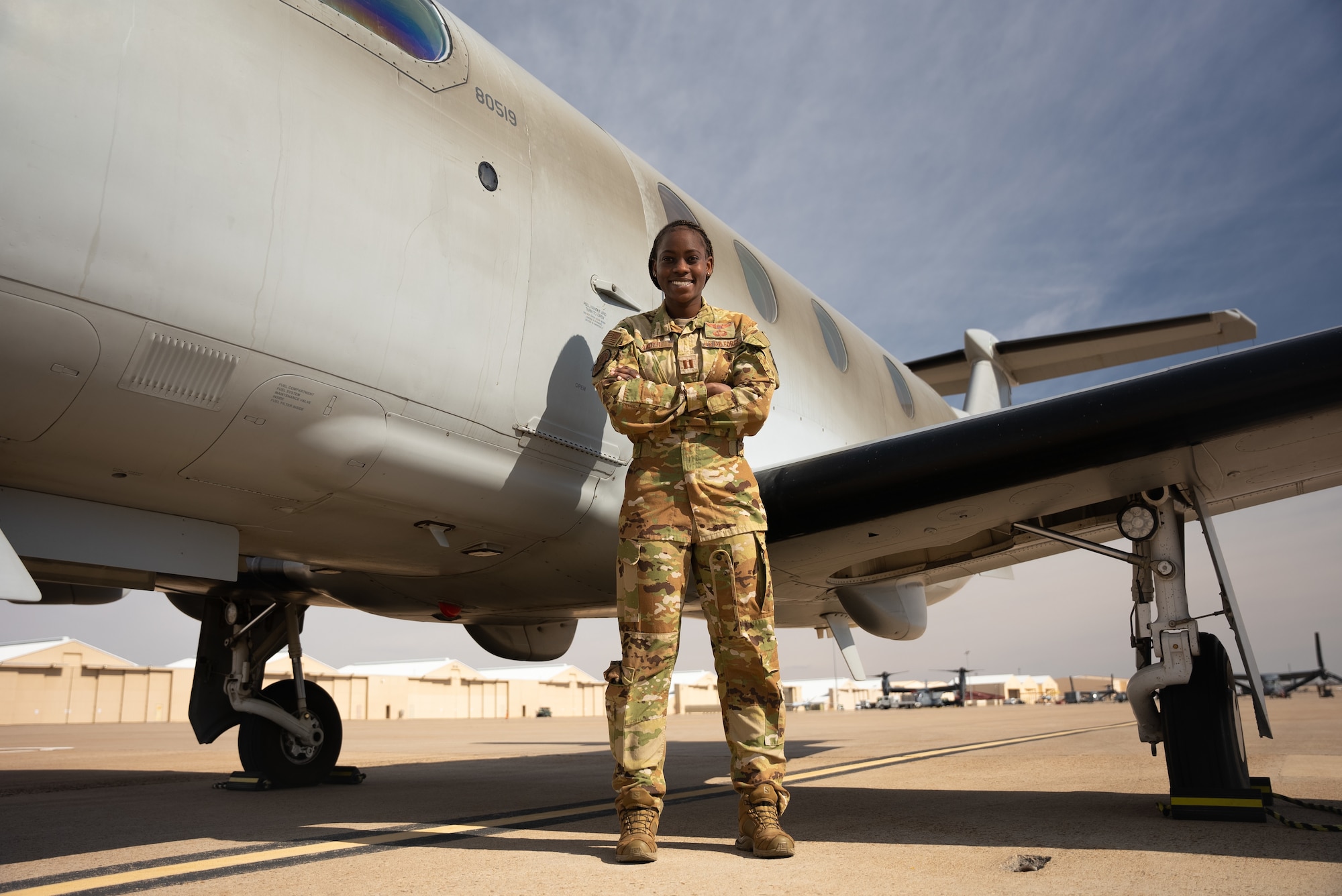 A female airman poses for a photo.