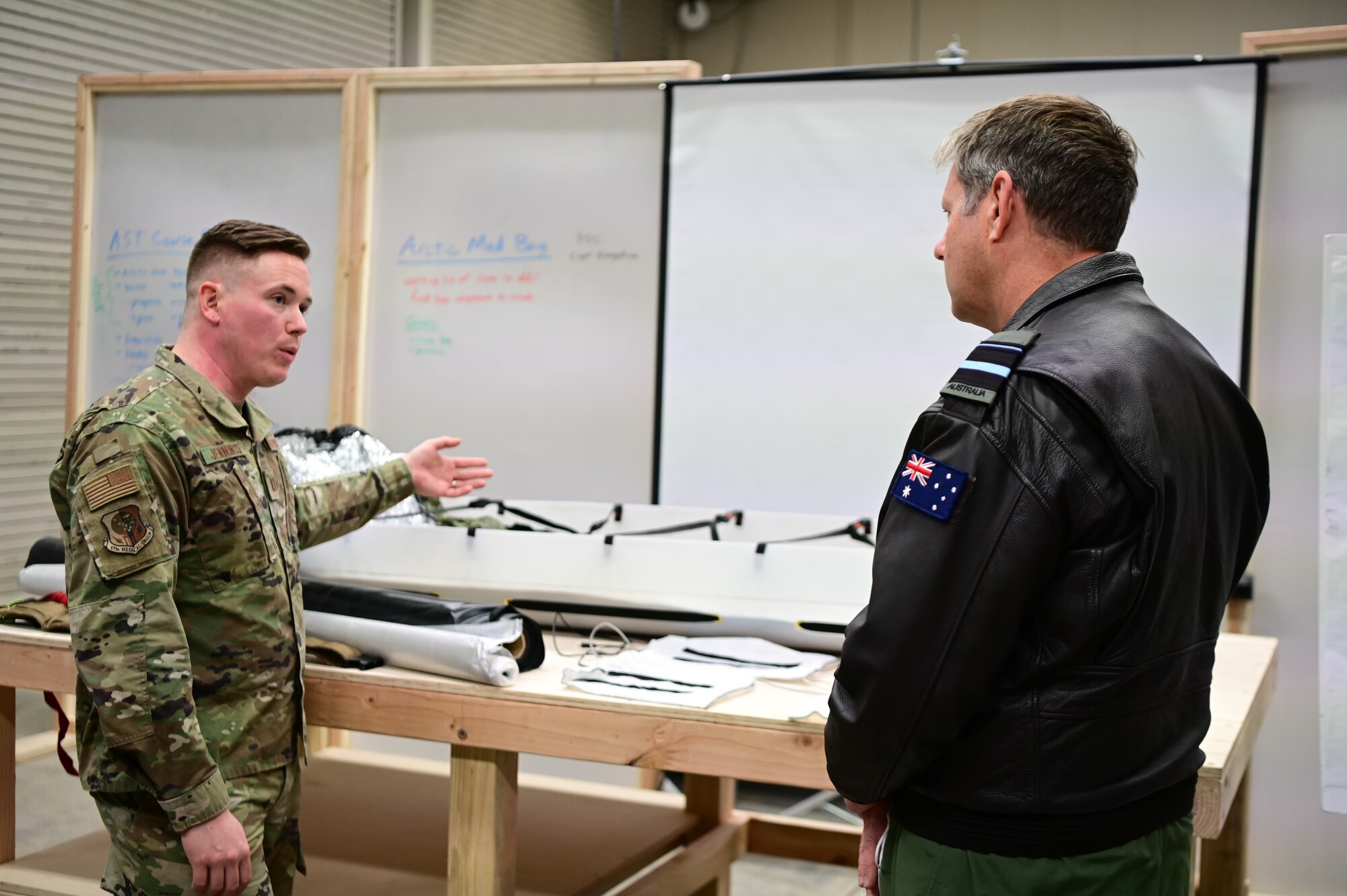 Royal Australian Air Force Air Vice-Marshal Carl Newman, Pacific Air Forces deputy commander, discusses the importance of health programs with leading officers of the 673d Medical Group at Joint Base Elmendorf-Richardson, Alaska, March 29, 2023. During the meeting, the 673d MDG presented Newman with informative slides on how mental health programs are actively supporting JBER’s Arctic Warriors. (U.S. Air Force photo by Airman 1st Class Quatasia Carter)