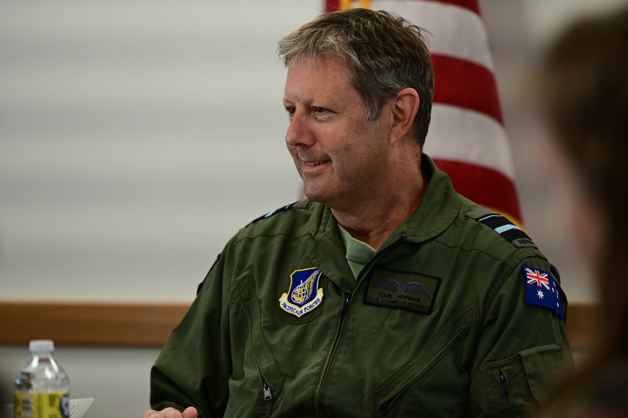 Royal Australian Air Force Air Vice-Marshal Carl Newman, Pacific Air Forces deputy commander, discusses the importance of health programs with leading officers of the 673d Medical Group at Joint Base Elmendorf-Richardson, Alaska, March 29, 2023. During the meeting, the 673d MDG presented Newman with informative slides on how mental health programs are actively supporting JBER’s Arctic Warriors. (U.S. Air Force photo by Airman 1st Class Quatasia Carter)