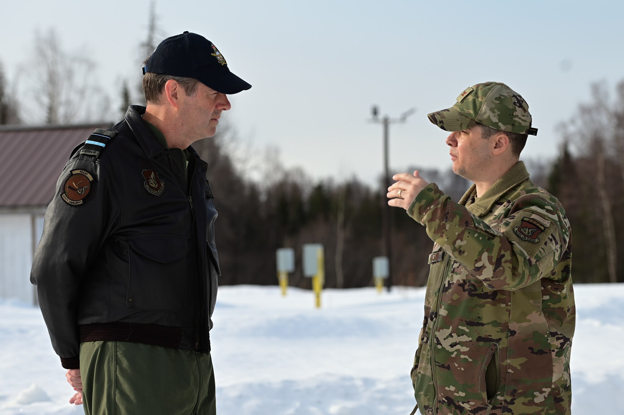 Royal Australian Air Force Air Vice-Marshal Carl Newman, Pacific Air Forces deputy commander, discusses the importance of health programs with leading officers of the 673d Medical Group at Joint Base Elmendorf-Richardson, Alaska, March 29, 2023. During the meeting, the 673d MDG presented Newman with informative slides on how mental health programs are actively supporting JBER’s Arctic Warriors. (U.S. Air Force photo by Airman 1st Class Quatasia Carter)