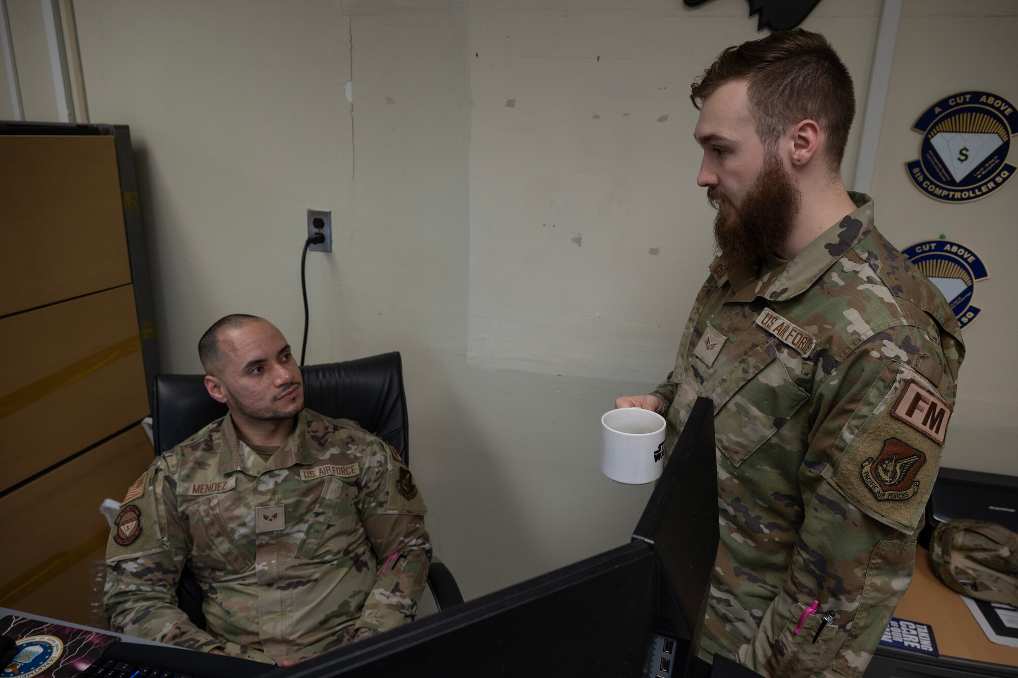 An Airman speaks to another Airman.