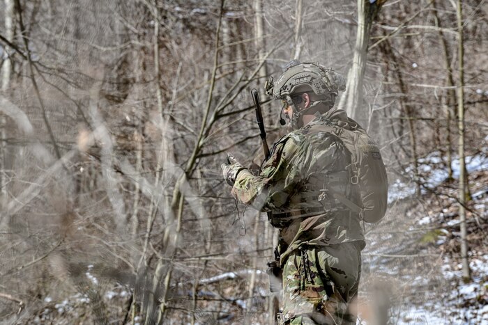 Tech. Sgt. Hanlet Contreras, a fireteam member assigned to the 459th Security Forces Squadron, Joint Base Andrews, Maryland, uses a compass to navigate on March 15, 2023, at Camp James A. Garfield Joint Military Training Center, Ohio.