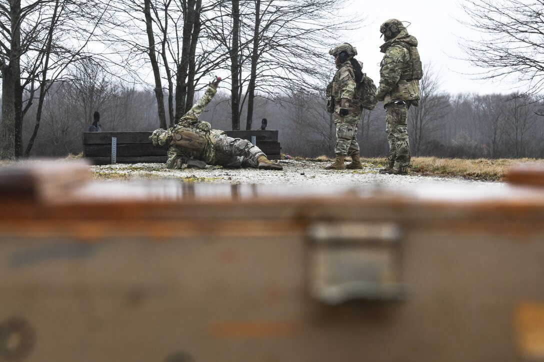 Integrated Defense Leadership Course cadre demonstrate how to throw a grenade on March 17, 2023, at Camp James A. Garfield Joint Military Training Center, Ohio.