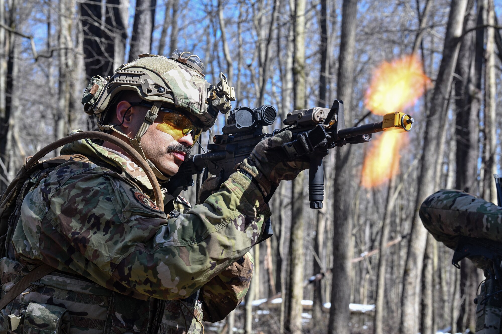 Tech. Sgt. Hanlet Contreras, a fireteam member assigned to the 459th Security Forces Squadron, Joint Base Andrews, Maryland, fires an M4 carbine on March 15, 2023, at Camp James A. Garfield Joint Military Training Center, Ohio.