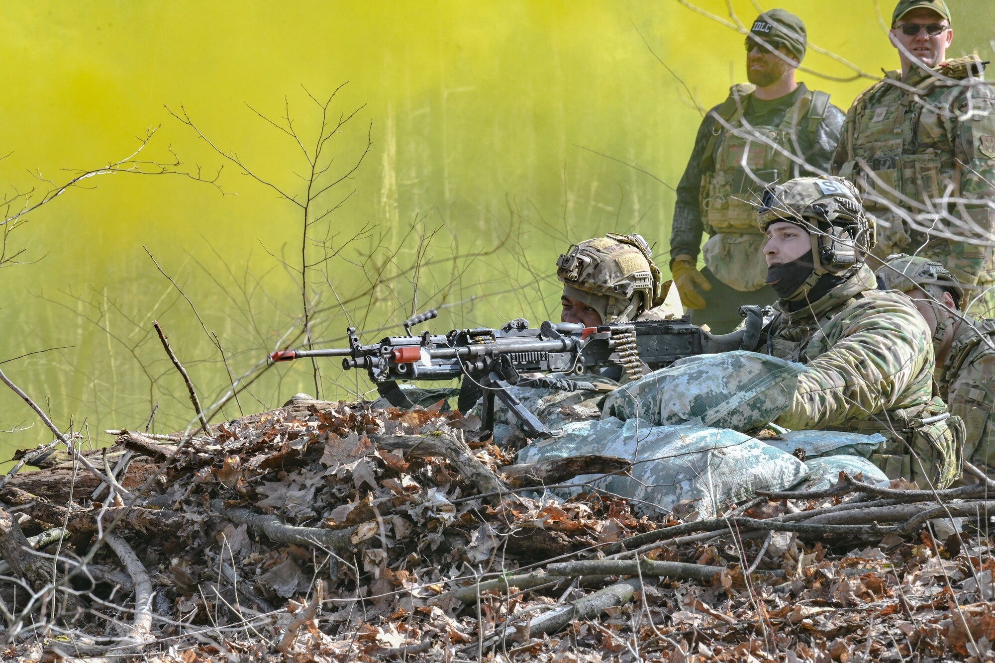 Reserve Citizen Airmen assigned to the 459th Security Forces Squadron, Joint Base Andrews, Maryland, fire a M240B machine gun and a M249 light machine gun during a static defense exercise on March 20, 2023, at Camp James A. Garfield Joint Military Training Center, Ohio.