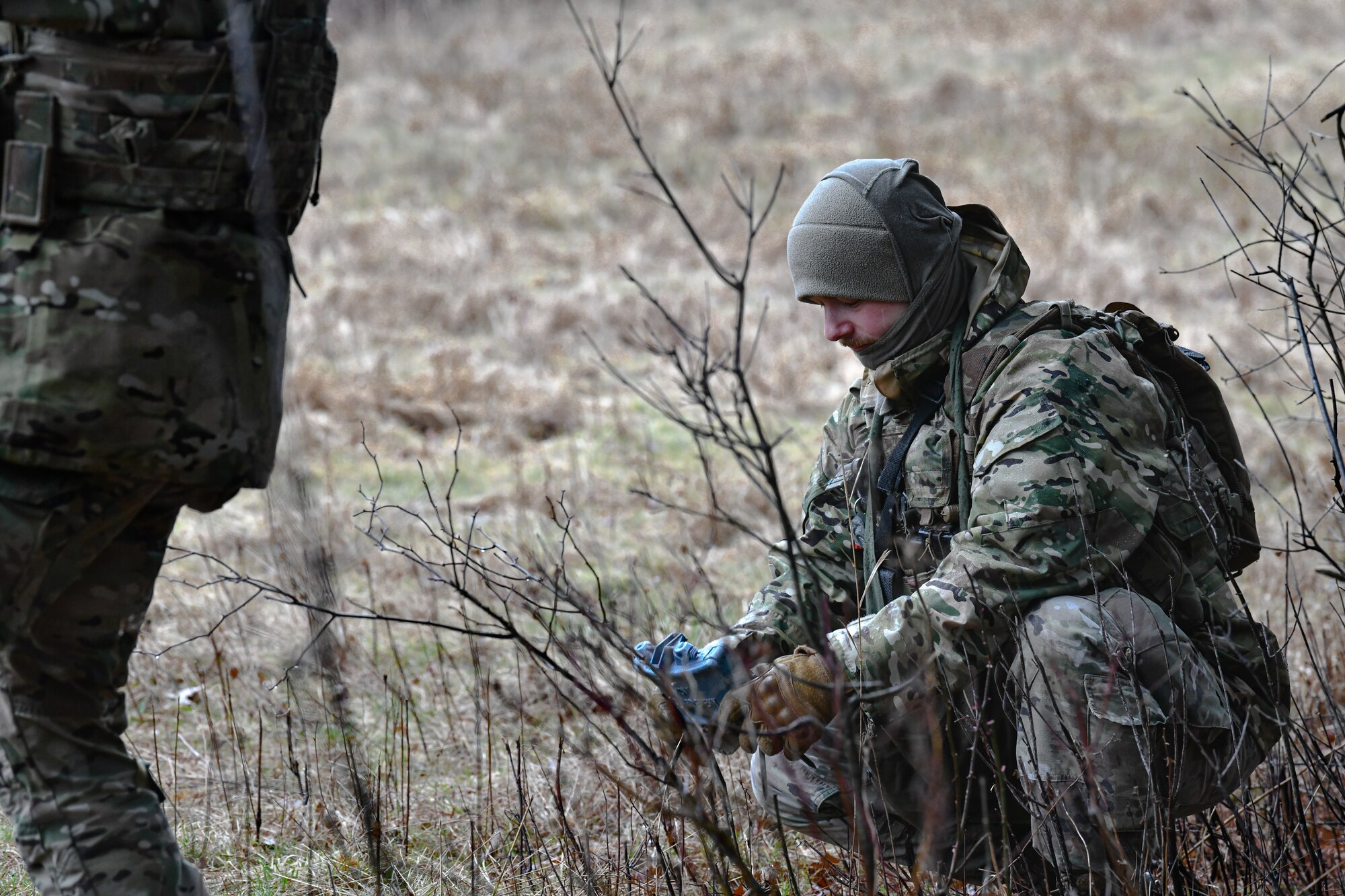 Tech. Sgt. Jason Barracato, a fireteam member assigned to the 459th Security Forces Squadron, Joint Base Andrews, Maryland, places a training claymore on March 17, 2023, at Camp James A. Garfield Joint Military Training Center, Ohio.