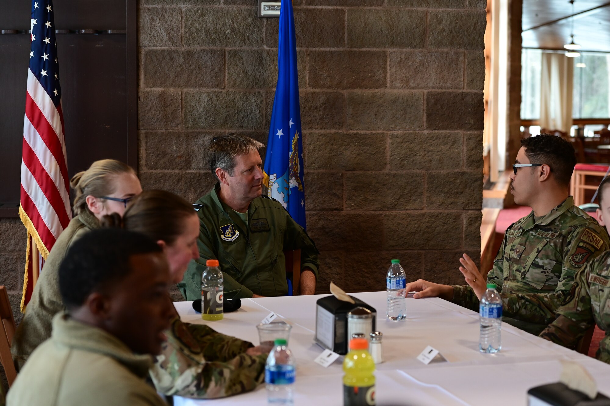 Royal Australian Air Force Air Vice-Marshal Carl Newman, Pacific Air Forces deputy commander, discusses the importance of health programs with leading officers of the 673d Medical Group at Joint Base Elmendorf-Richardson, Alaska, March 29, 2023. During the meeting, the 673d MDG presented Newman with informative slides on how mental health programs are actively supporting JBER’s Arctic Warriors. (U.S. Air Force photo by Airman 1st Class Quatasia Carter)