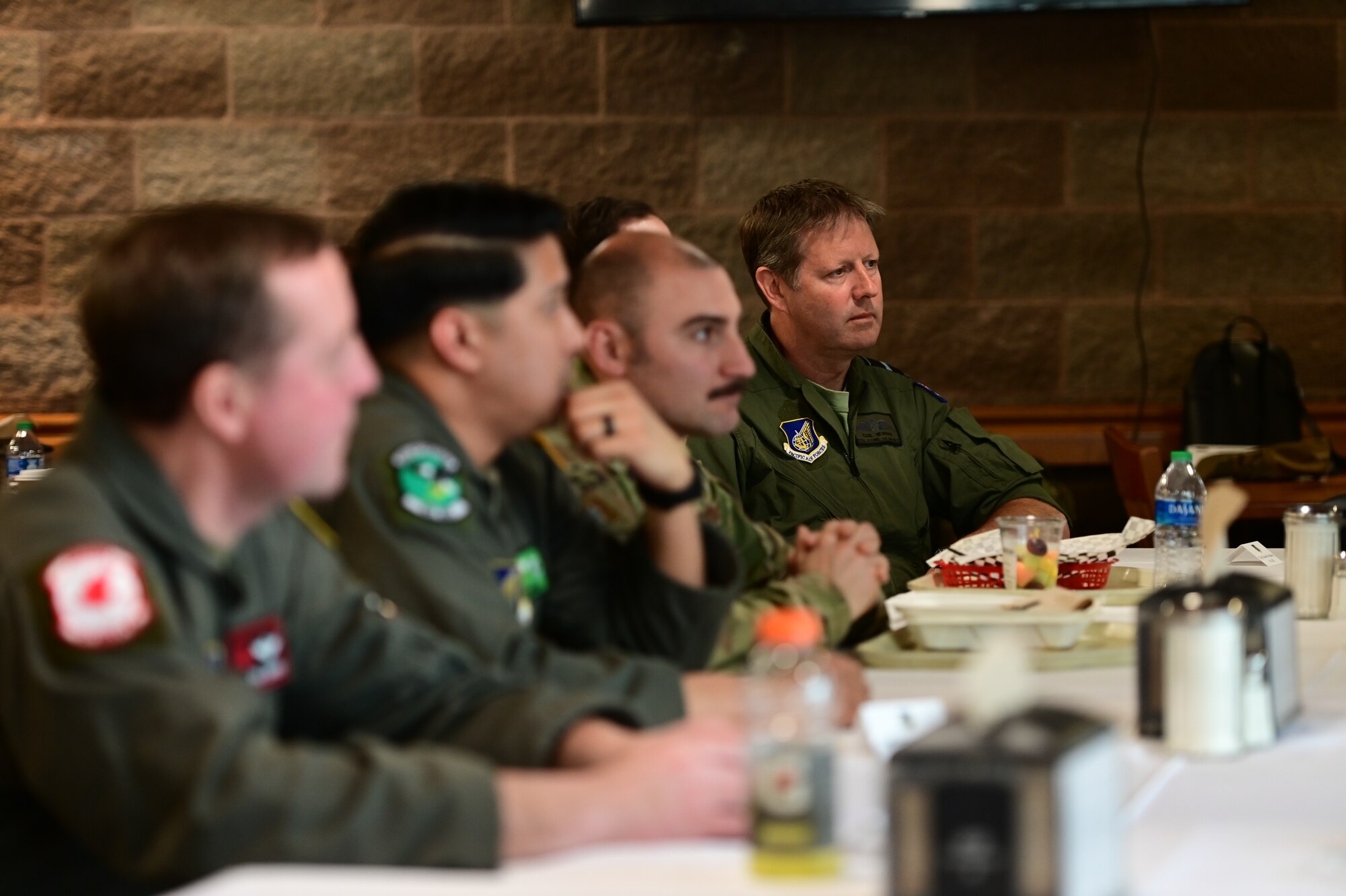 Royal Australian Air Force Air Vice-Marshal Carl Newman, Pacific Air Forces deputy commander, discusses the importance of health programs with leading officers of the 673d Medical Group at Joint Base Elmendorf-Richardson, Alaska, March 29, 2023. During the meeting, the 673d MDG presented Newman with informative slides on how mental health programs are actively supporting JBER’s Arctic Warriors. (U.S. Air Force photo by Airman 1st Class Quatasia Carter)