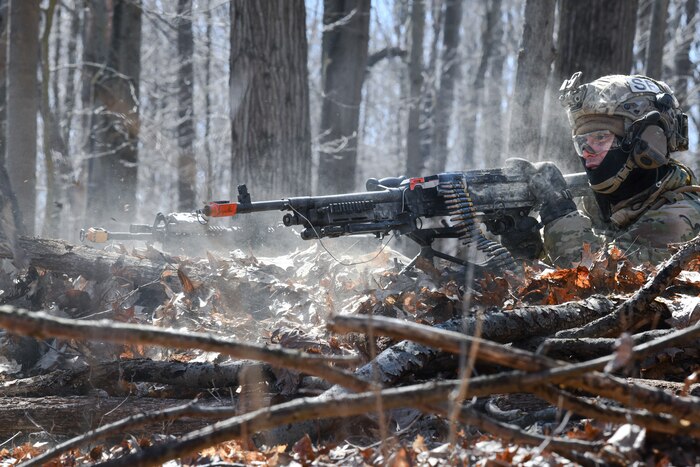 Airman 1st Class Devon Aziz, a fireteam member assigned to the 459th Security Forces Squadron, Joint Base Andrews, Maryland, fires a M240B machine gun at Camp James A. Garfield Joint Military Training Center, Ohio.