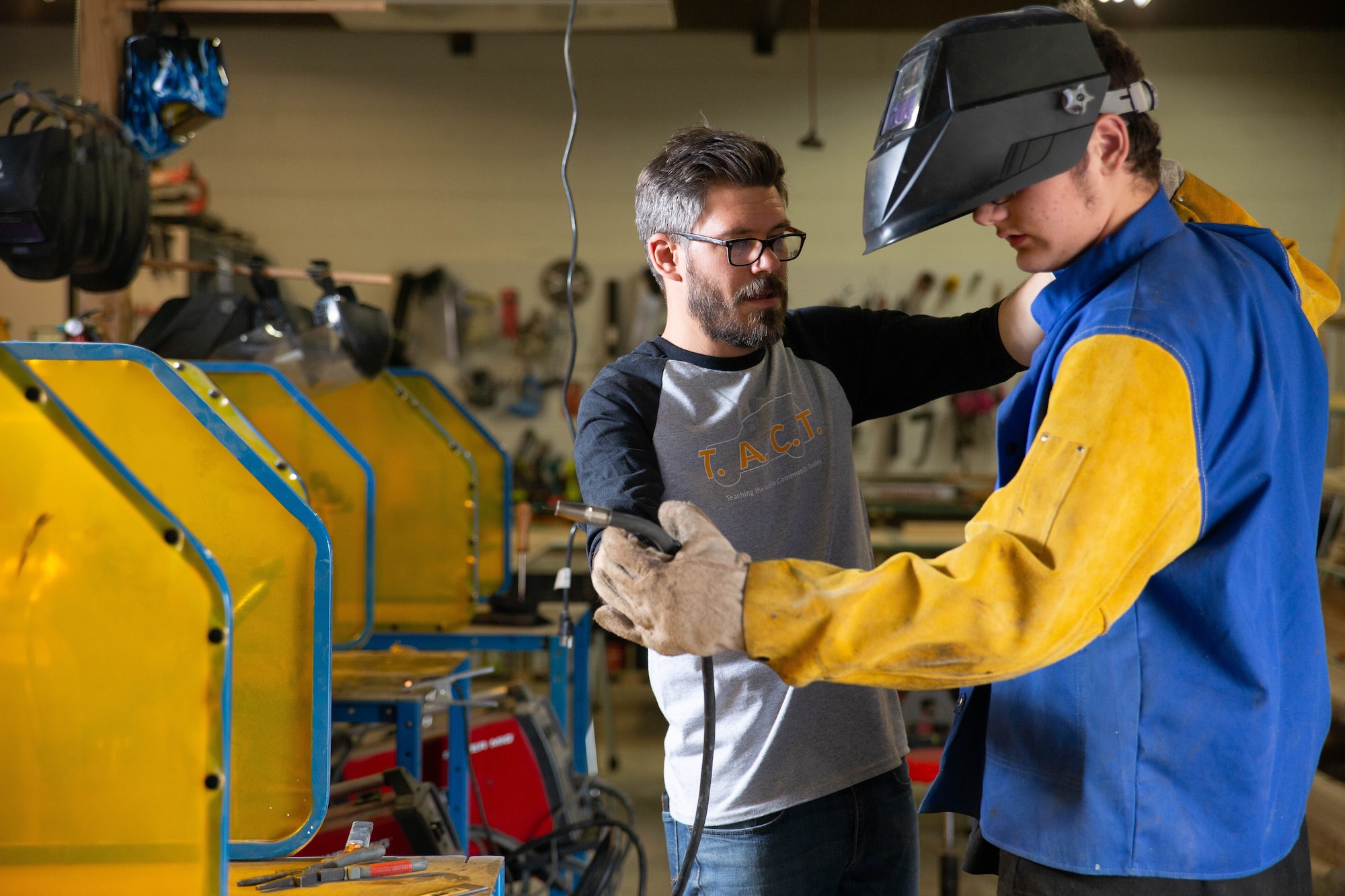 Danny Combs provides welding instruction to a student at his Teaching the Autism Community Trades workshop. (Courtesy photo)