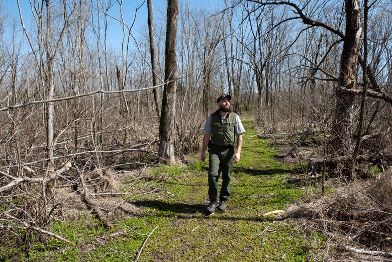 Park Ranger Steve Acuff, biologist and natural resources specialist at Cheatham Lake, observes the underbrush along the TSU Trail near Sam’s Creek while inspecting the area March 27, 2023, in Ashland City, Tennessee. (USACE Photo by Lee Roberts)