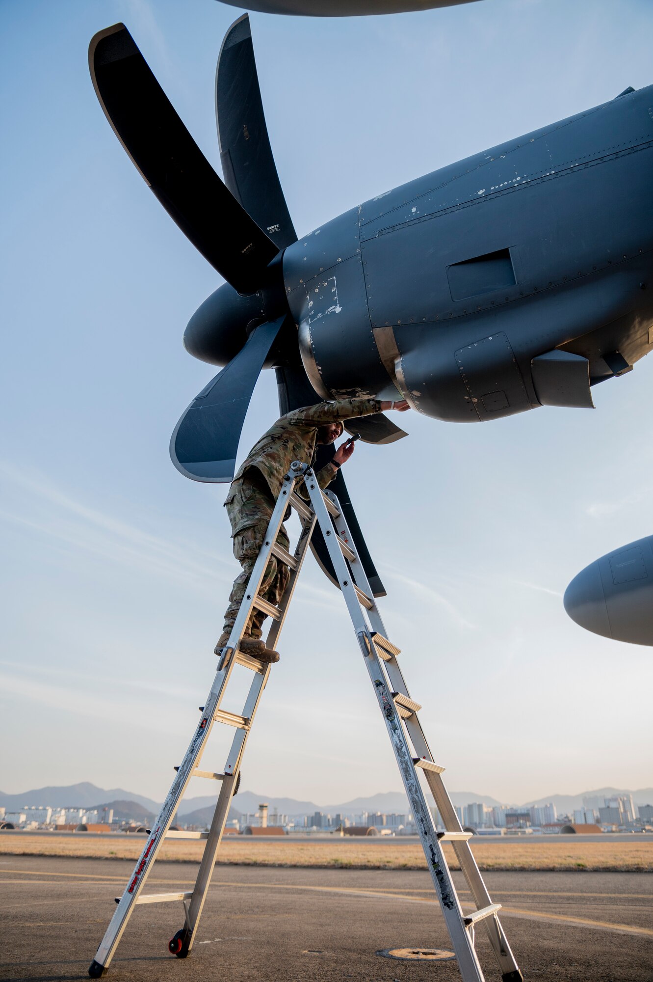A U.S. Airman assigned to the 353rd Special Operations Aircraft Maintenance Squadron inspects the engine air-intake of an MC-130J Commando II in preparation of Freedom Shield 23 at Daegu Air Base, Republic of Korea, Mar. 13, 2023.