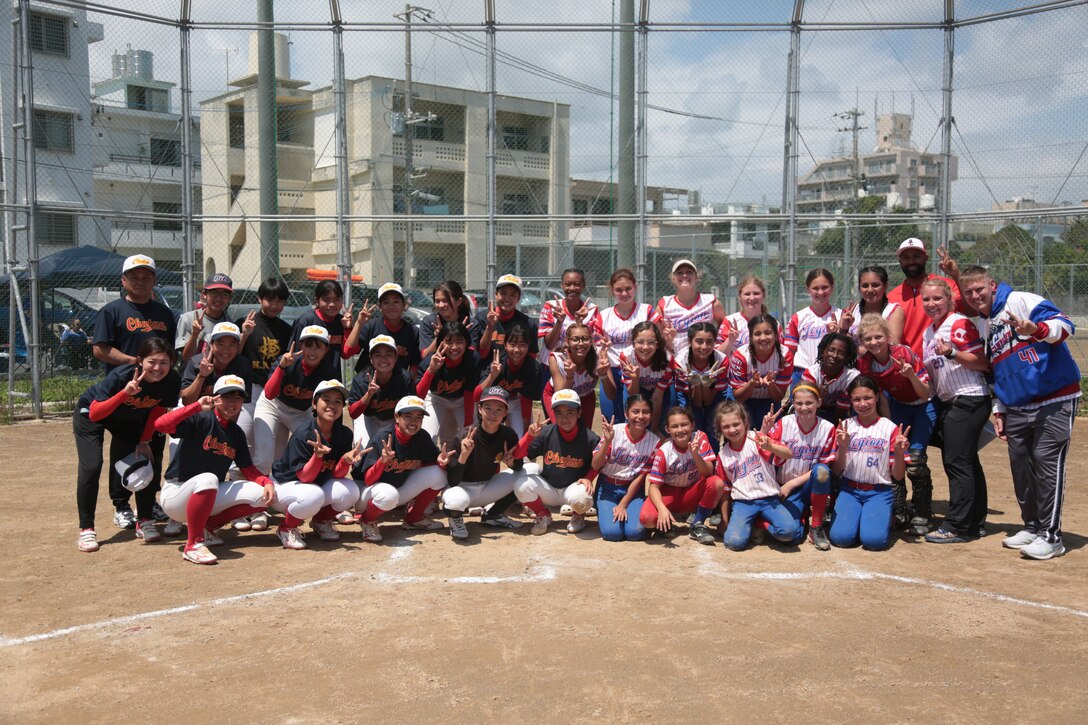 The American Legion Fast Pitch Softball team, comprised of dependents from across the SOFA community, plays against a combined local Junior High School team, a third ranked in Okinawa prefecture, in the fast-pitch softball game on Aril 2 to strengthening relationships with allies and partners.