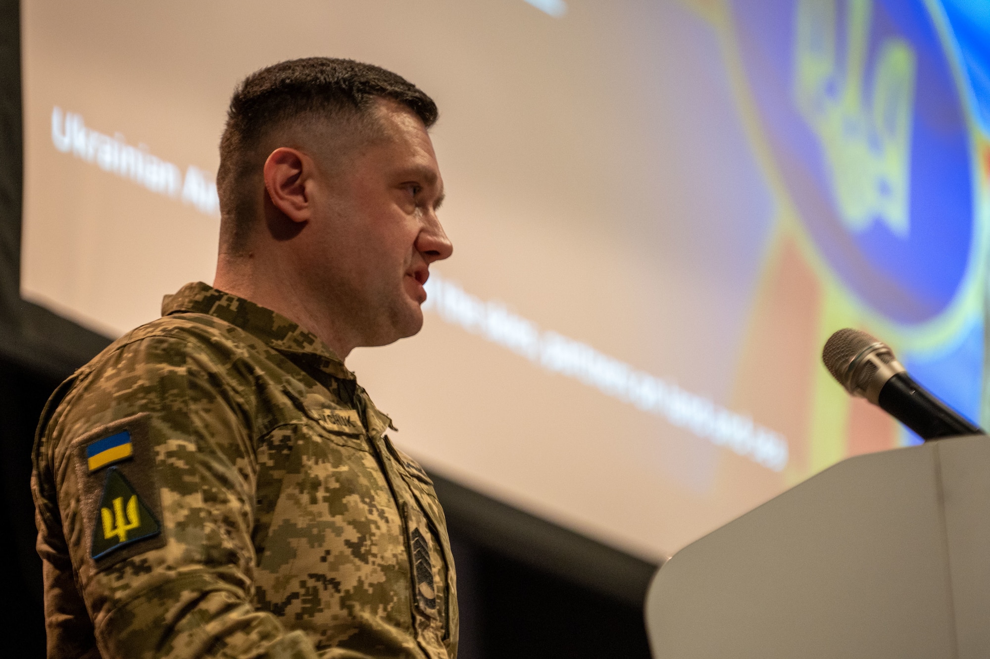 Chief Master Sgt. of the Air Force of the Armed Forces of Ukraine Kostiantyn Stanislavchuk briefs U.S. Air Force service members at Ramstein Air Base, Germany, March 14, 2023. Chief Stanislavchuk delivered two "NCO perspective from the frontlines" presentations to Ramstein servicemembers. (U.S. Air Force photo by Tech. Sgt. Steven Adkins)