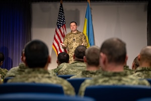 Chief Master Sgt. of the Air Force of the Armed Forces of Ukraine Kostiantyn Stanislavchuk speaks to attendees of an all-call hosted March 22, 2023, at Spangdahlem Air Base, Germany. The purpose of Chief Stanislavchuk’s visit was to enhance joint nation interoperability and discuss issues affecting the international community of enlisted Airmen. (U.S. Air Force photo by Senior Airman Jessica Sanchez-Chen)