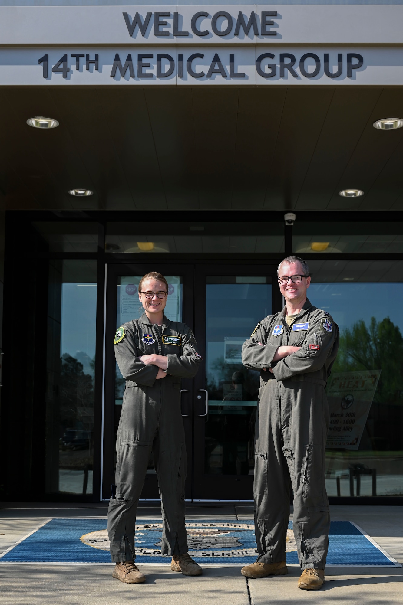 U.S. Air Force Capt. Hailey Faist, MD, 14th Medical Group flight surgeon and Capt. James Bates, DO, 14th Medical Group Aerospace Medicine chief (SGP), stand in front of the 14th MDG, on Columbus Air Force Base, Miss., Mar. 30, 2023. Dr. Faist and Dr. Bates proposed an updated list of medications to treat Urinary Tract Infections, which was recently accepted, and will directly impact mission readiness. (U.S. Air Force photo by Senior Airman Jessica Haynie)