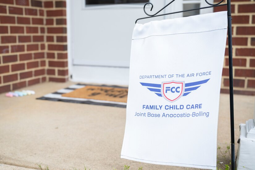 A Family Child Care banner stands out front of an FCC provider’s home on March 31, 2023, at Joint Base Anacostia-Bolling, Washington, D.C. FCC providers care for children in the provider’s home, which increases child care capacity for the JBAB community while simultaneously creating work-from-home employment opportunities. (U.S. Air Force photo by Jason Treffry)