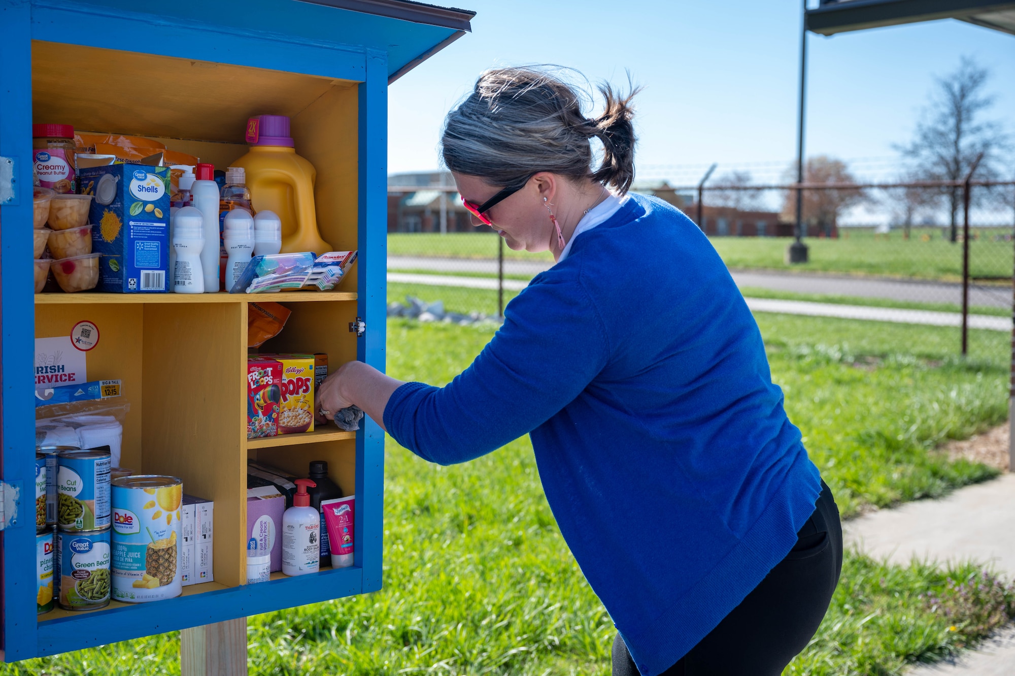 Woman filling box with food